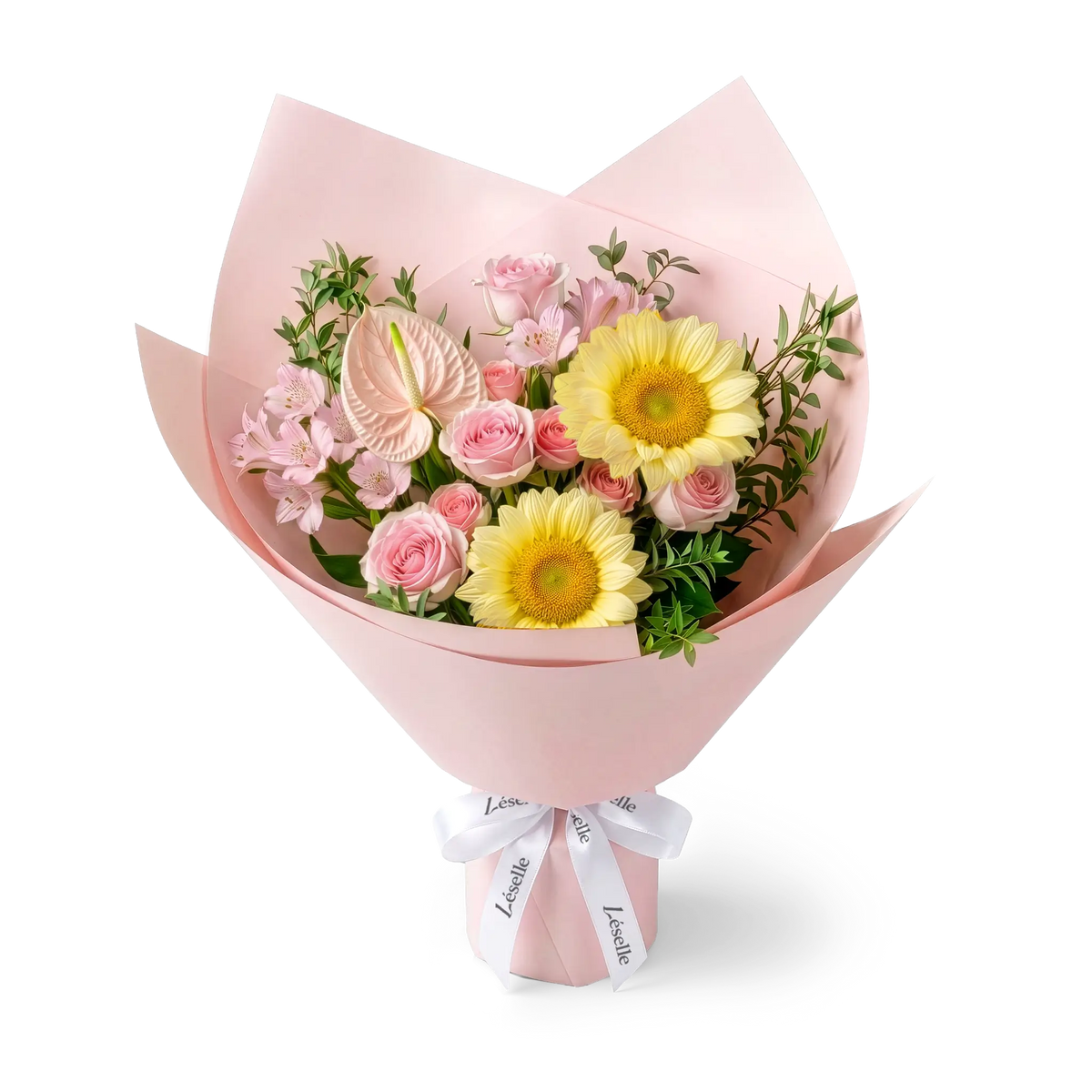 A wrapped flower bouquet featuring cream-color sunflowers, pink roses, a pink anthurium, and green foliage, wrapped in a pink paper sleeve with a white ribbon, on a transparent background.