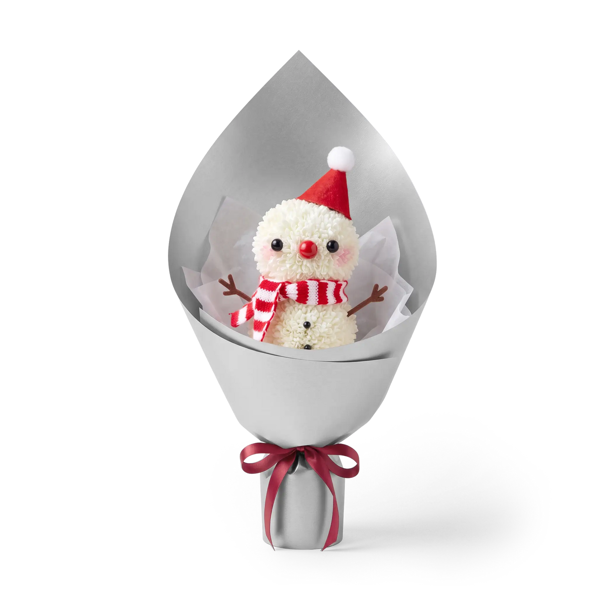 Winter Snowman Pompon Bouquet made of fresh white pompon chrysanthemums. This Christmas floral arrangement features a snowman with a red hat and striped scarf, wrapped in silver paper.